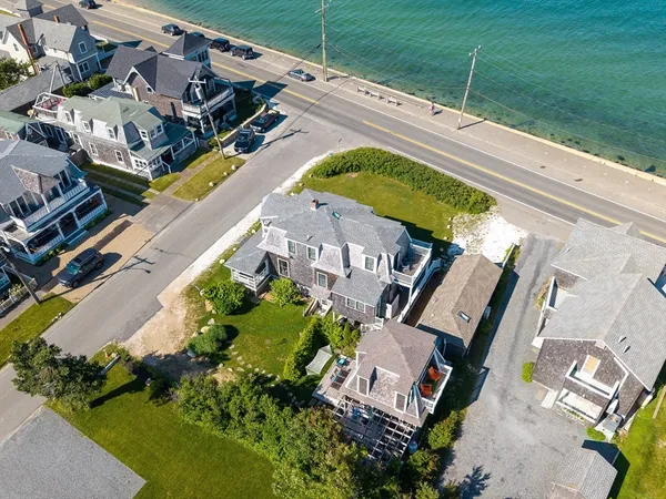 an aerial view of a house with a swimming pool
