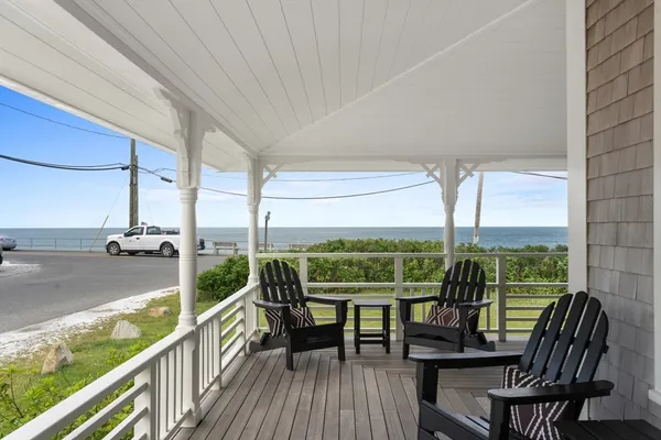 a view of a balcony with lake view and a floor to ceiling window