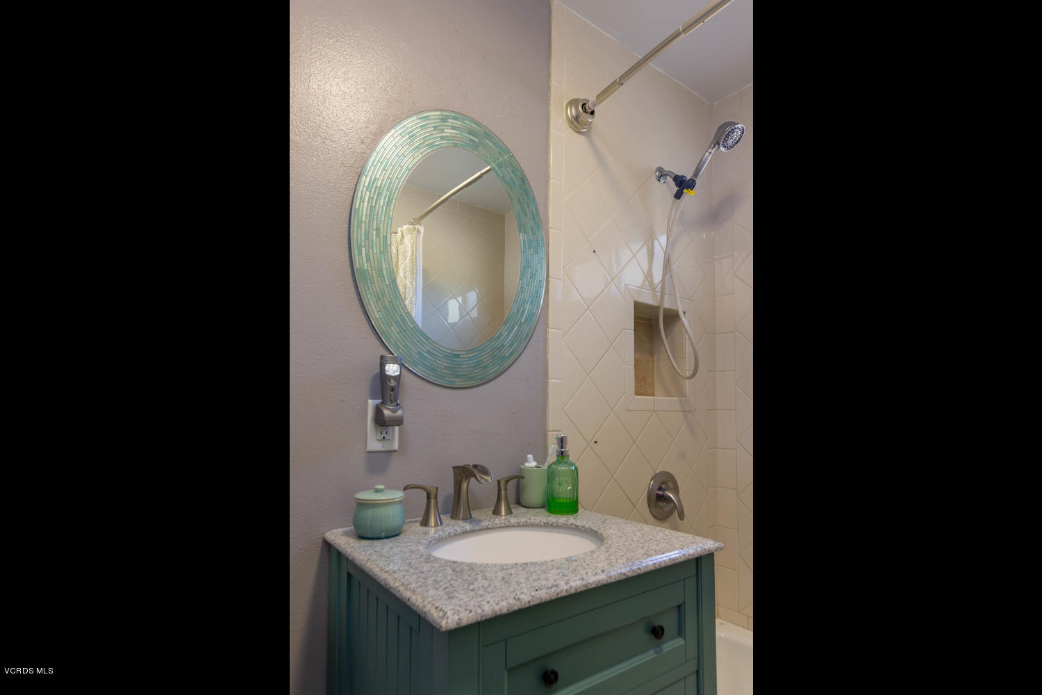 919 Laurel Road Santa Paula, CA 93060 - Photo 14 of 21 a bathroom with a sink and a mirror
