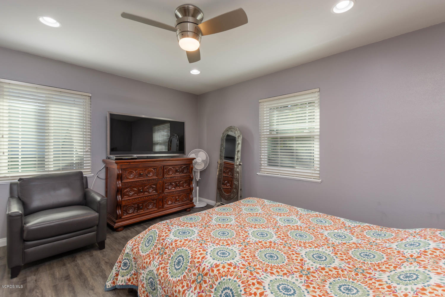 919 Laurel Road Santa Paula, CA 93060 - Photo 16 of 21 a bedroom with furniture and a flat screen tv