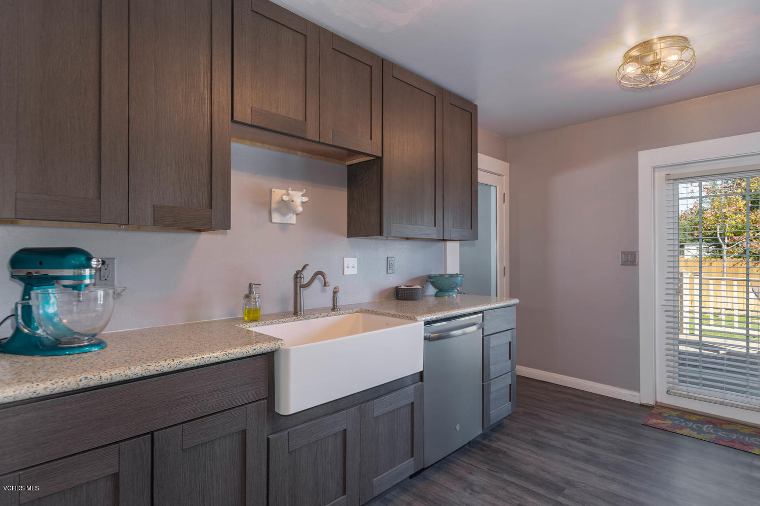 919 Laurel Road Santa Paula, CA 93060 - Photo 4 of 21 a kitchen with a sink cabinets and window