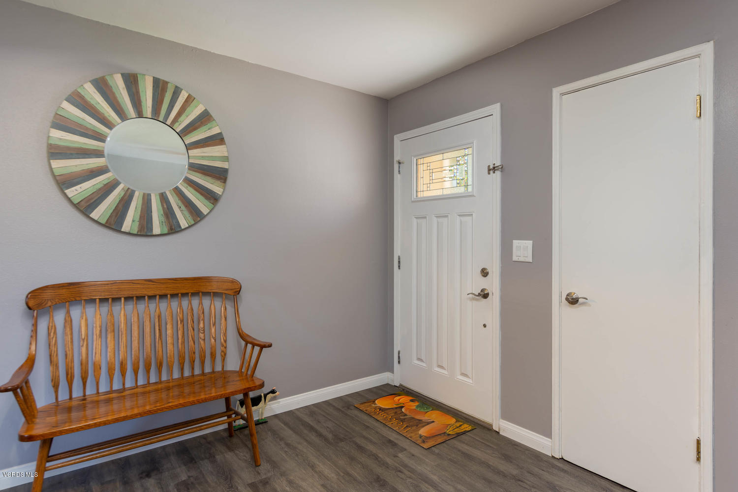 919 Laurel Road Santa Paula, CA 93060 - Photo 6 of 21 an empty room with wooden floor and windows