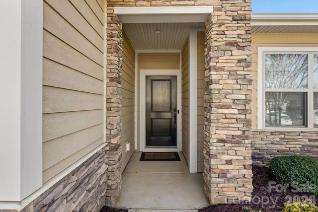 a view of front door of a house with a window