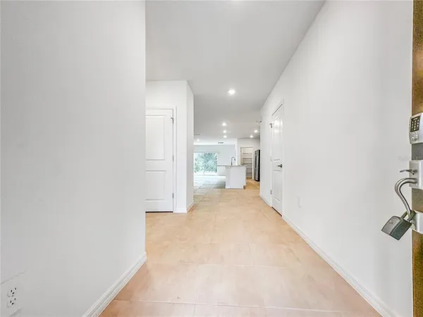 a view of a hallway with a bathroom