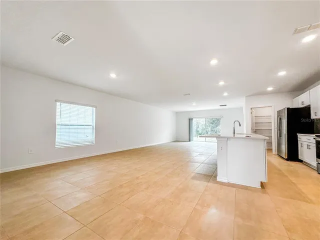 a view of a kitchen with furniture and a window