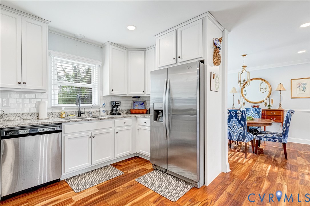 202 Bruce Road Tappahannock, VA 22560 - Photo 12 of 36 a kitchen with stainless steel appliances granite countertop a refrigerator and a stove top oven