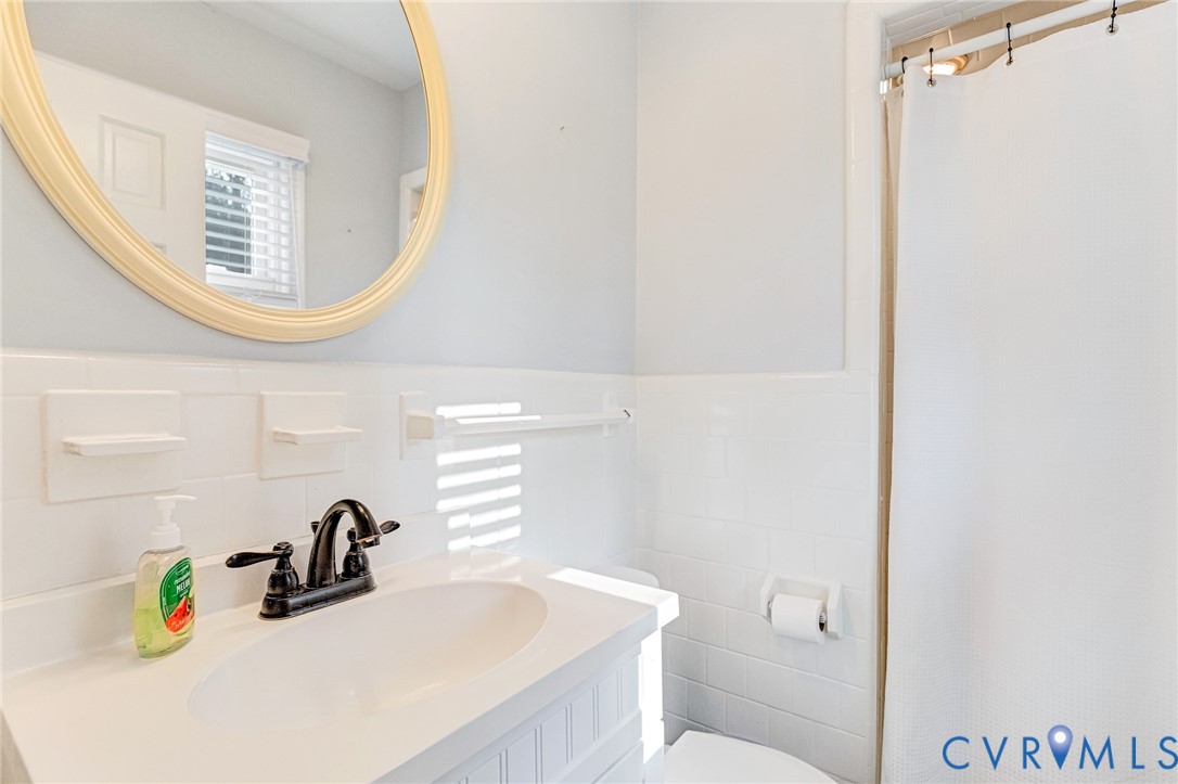 202 Bruce Road Tappahannock, VA 22560 - Photo 26 of 36 a bathroom with a sink and a mirror