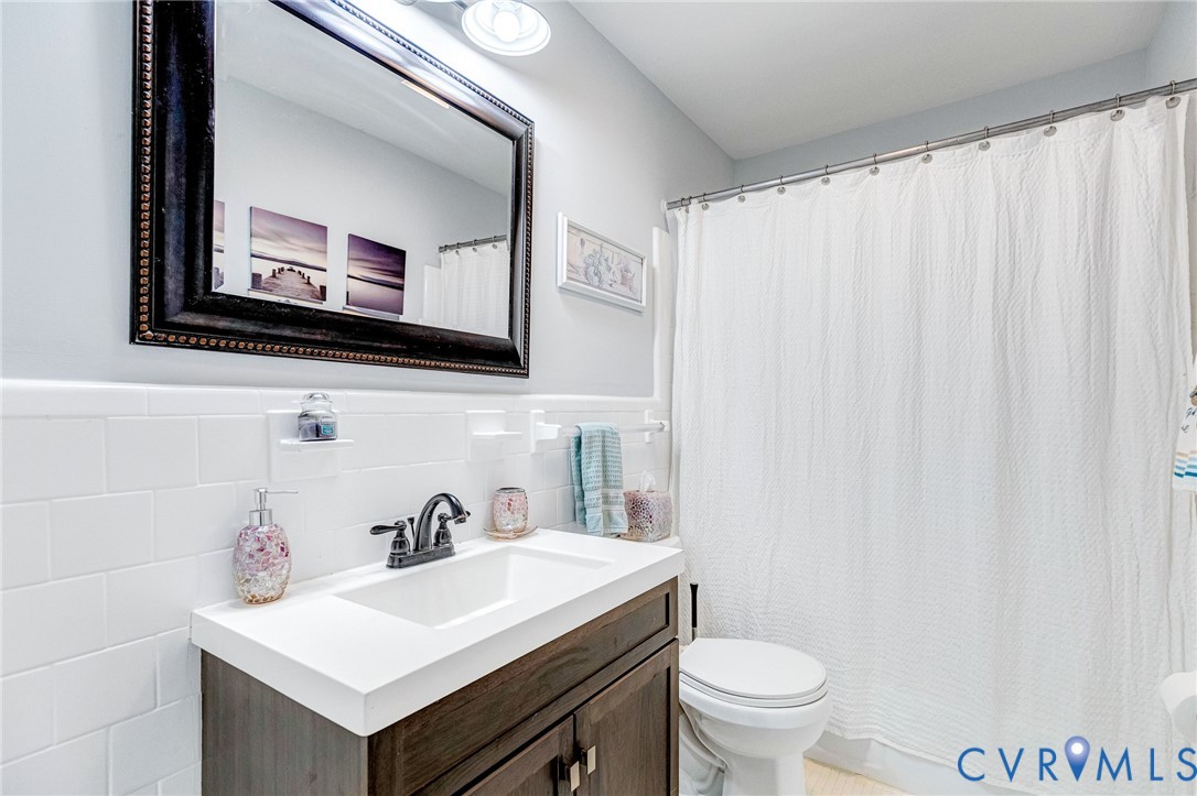 202 Bruce Road Tappahannock, VA 22560 - Photo 29 of 36 a bathroom with a sink mirror and toilet