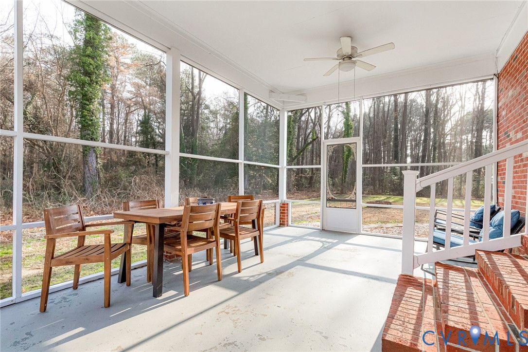 202 Bruce Road Tappahannock, VA 22560 - Photo 30 of 36 a living room filled with furniture and a large window