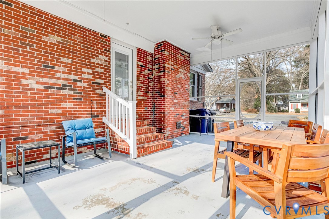 202 Bruce Road Tappahannock, VA 22560 - Photo 31 of 36 a living room with furniture and a chandelier