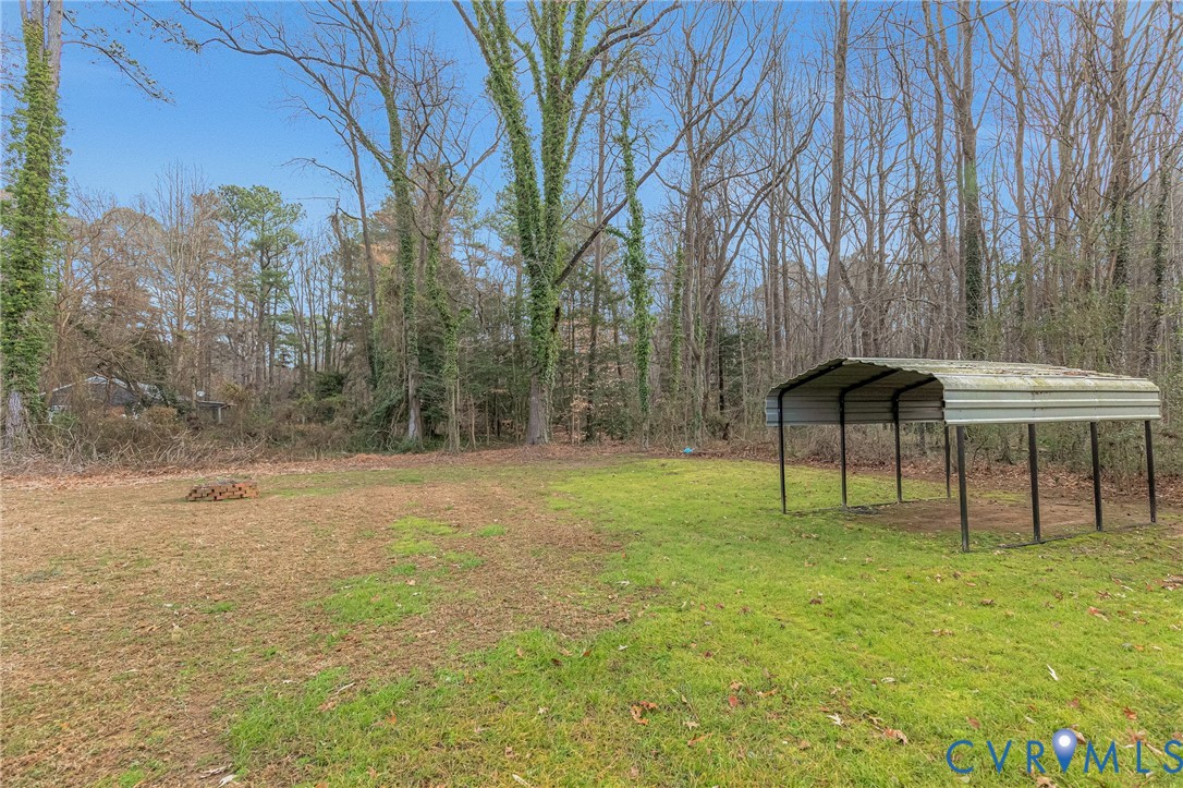 202 Bruce Road Tappahannock, VA 22560 - Photo 34 of 36 a view of a backyard with a garden and entertaining space
