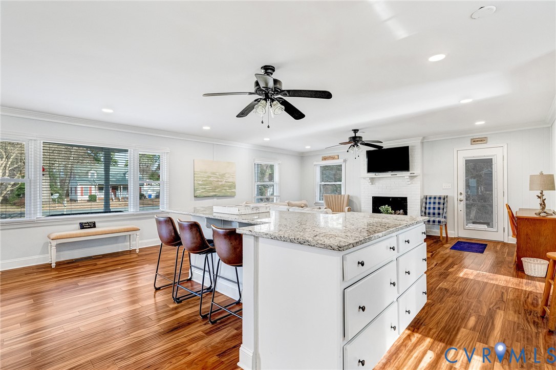 202 Bruce Road Tappahannock, VA 22560 - Photo 7 of 36 a open kitchen with granite countertop kitchen island stainless steel appliances a dining table and chairs