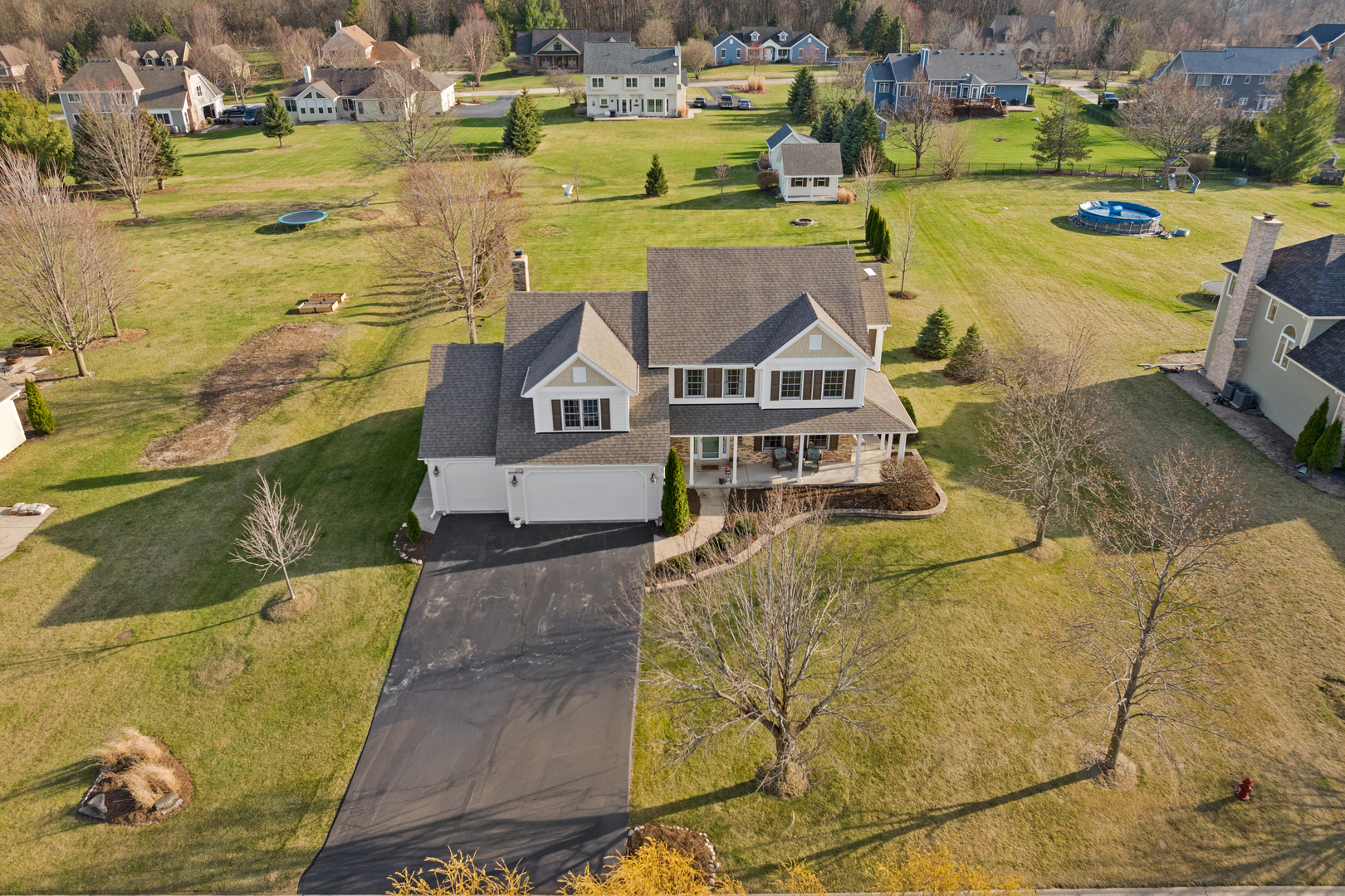 375 Meadow View Burlington, IL 60109 - Photo 4 of 9 a view of a swimming pool with outdoor seating