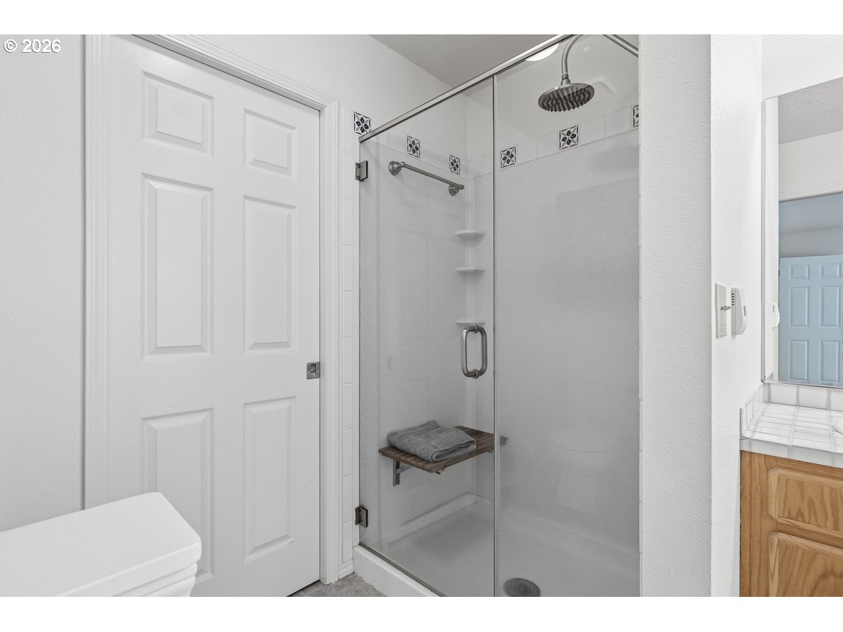 9675 Southwest 163rd Avenue Beaverton, OR 97007 - Photo 15 of 26 a bathroom with a shower and a sink