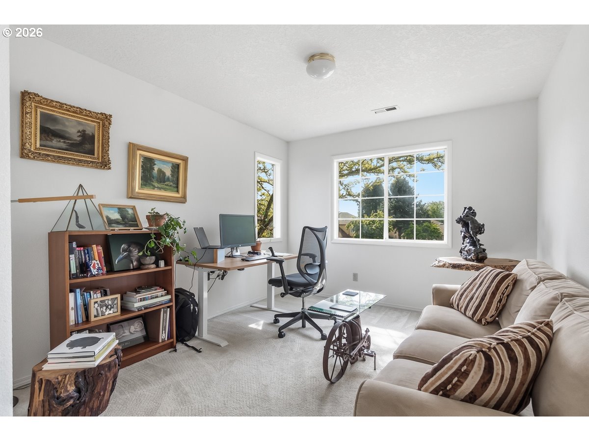 9675 Southwest 163rd Avenue Beaverton, OR 97007 - Photo 16 of 26 a living room with furniture and a window