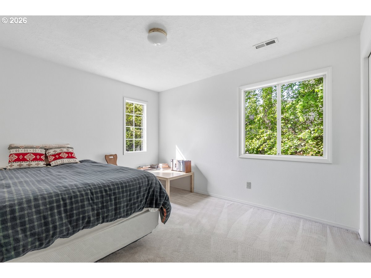 9675 Southwest 163rd Avenue Beaverton, OR 97007 - Photo 18 of 26 a bedroom with a bed and window