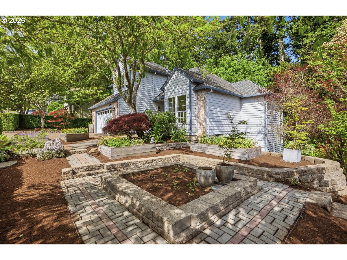 9675 Southwest 163rd Avenue Beaverton, OR 97007 - Photo 25 of 26 a front view of a house with a yard