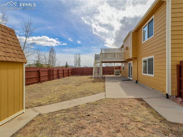Fenced yard with storage shed.  This is a 1/2 acre lot, so there is more of the lot outside the fenced area!