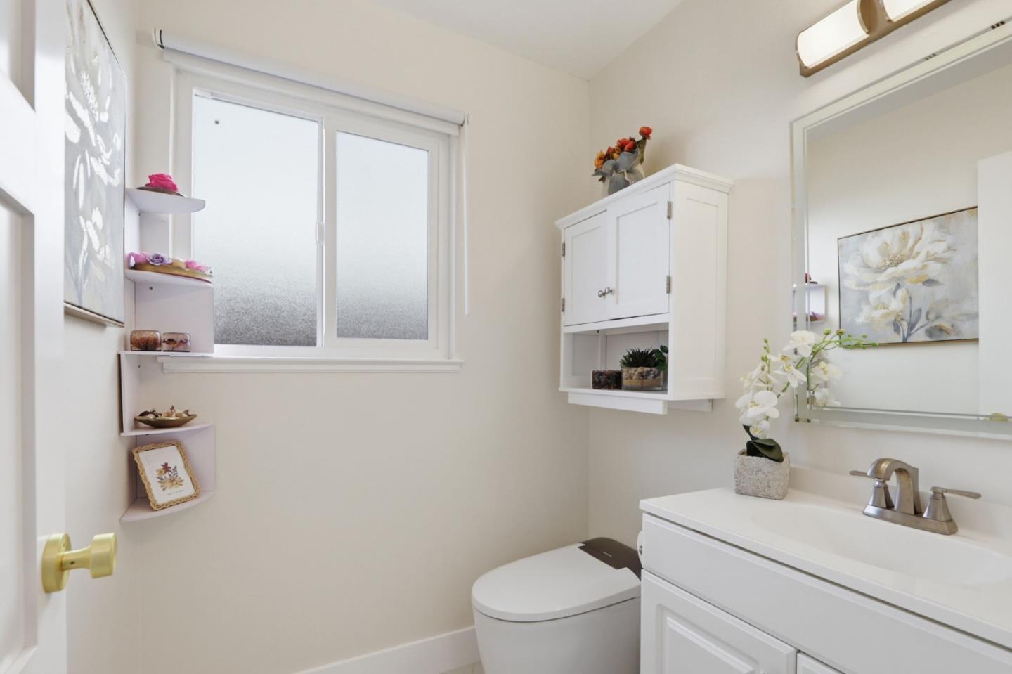 5888 Lean Way San Jose, CA 95123 - Photo 39 of 54 a bathroom with a sink vanity mirror and toilet