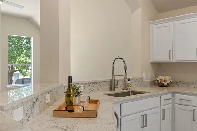 a kitchen with sink and window
