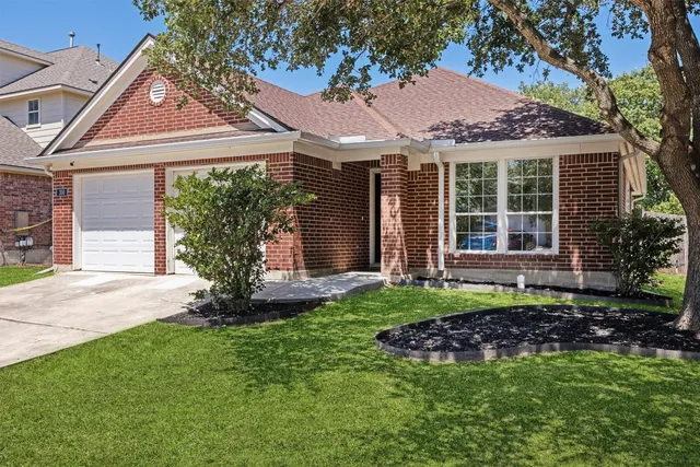 a front view of a house with a garden and porch