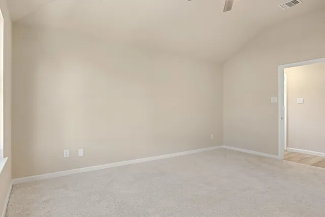 a bathroom with a granite countertop sink mirror and a bath tub