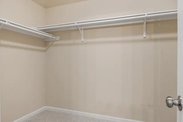 a bathroom with a granite countertop toilet a sink and a bathtub