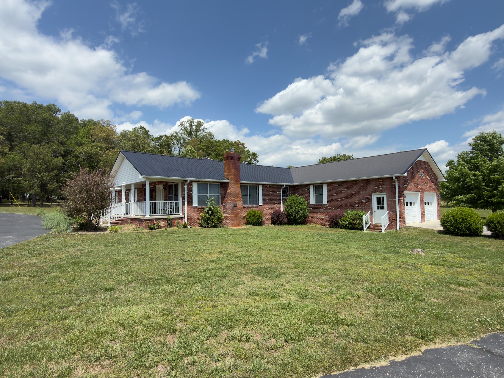 4929 Fountain Grove Road Morrison, TN 37357 - Photo 9 of 33 a front view of a house with a garden