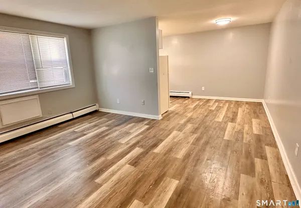 a view of an empty room and window