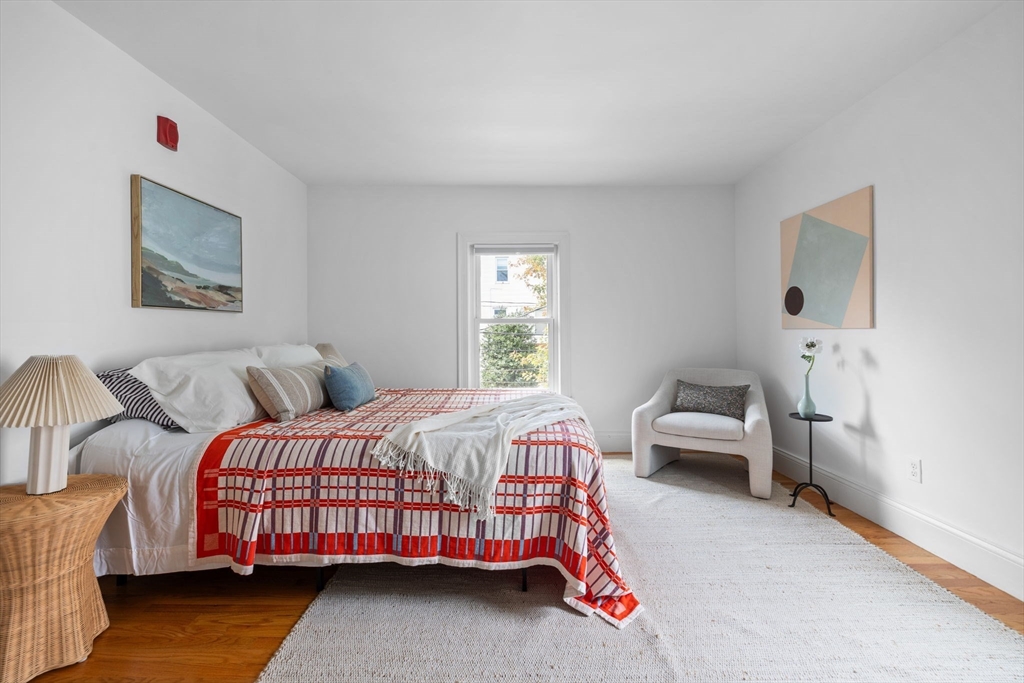 25 Clark Street, Unit 2 Somerville, MA 02143 - Photo 11 of 20 a bedroom with a bed and a couch