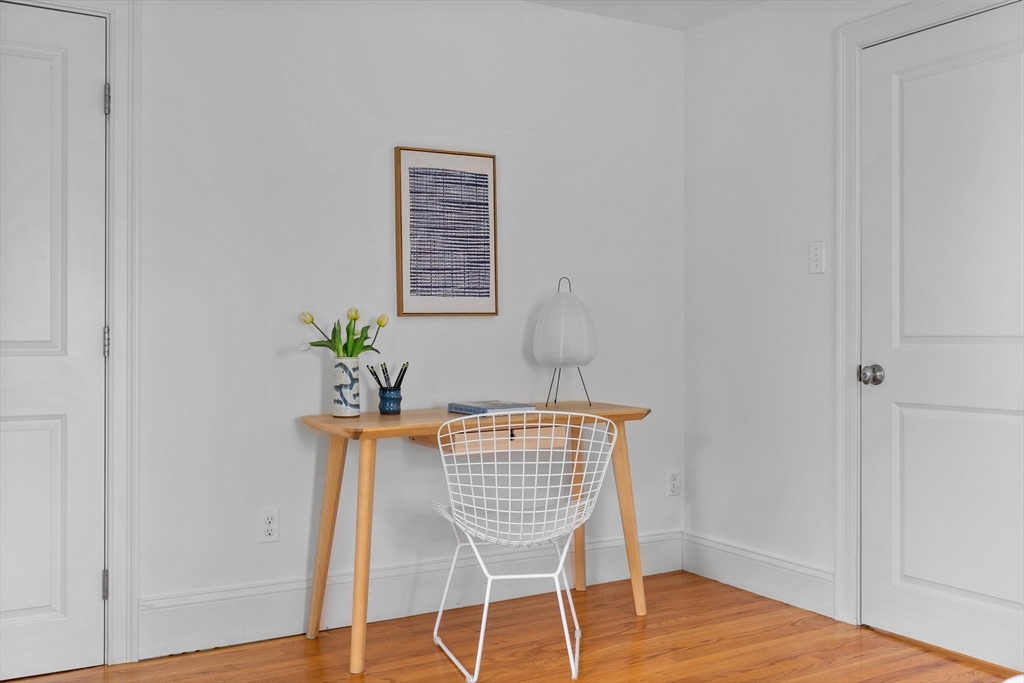 25 Clark Street, Unit 2 Somerville, MA 02143 - Photo 14 of 20 a view of a room with wooden floor and a potted plant