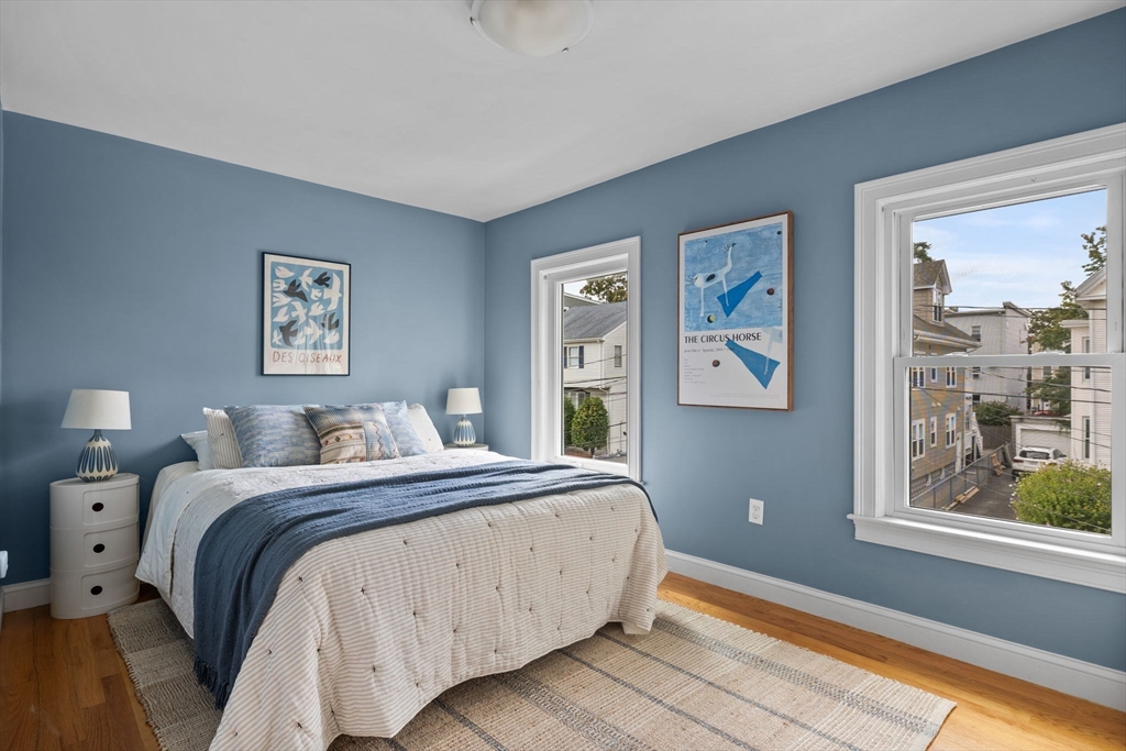 25 Clark Street, Unit 2 Somerville, MA 02143 - Photo 17 of 20 a bedroom with a bed and a window