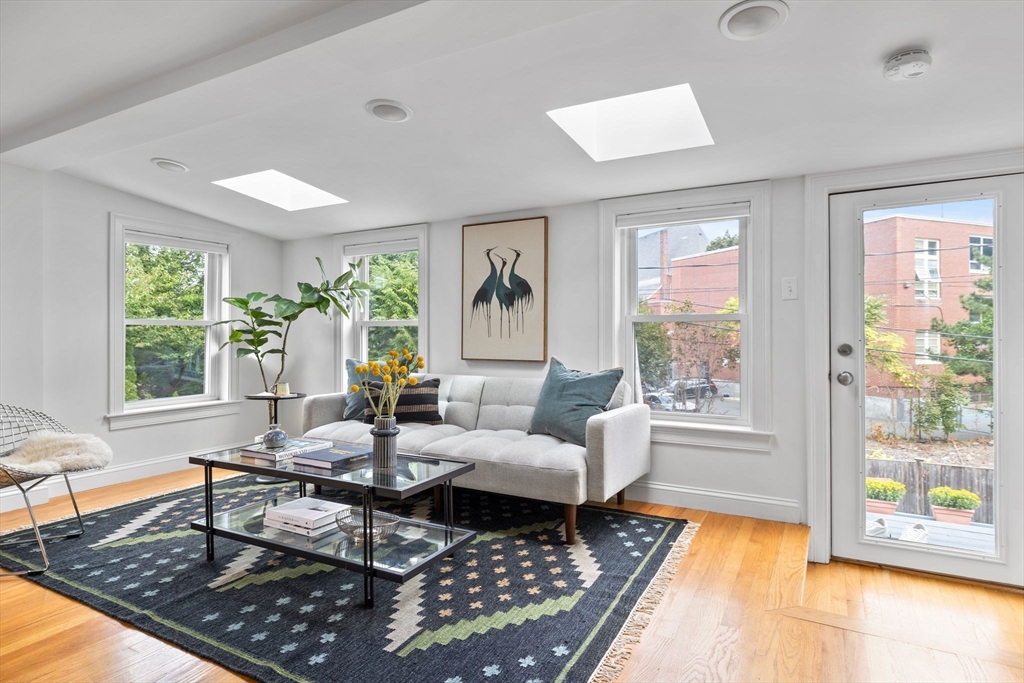 25 Clark Street, Unit 2 Somerville, MA 02143 - Photo 2 of 20 a living room with furniture and a rug