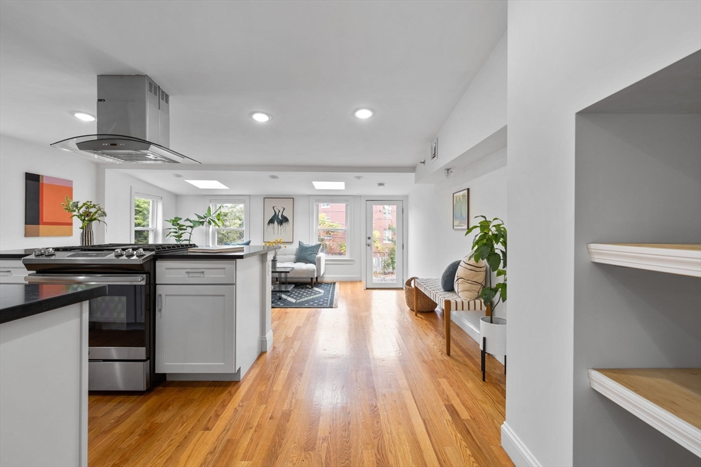 25 Clark Street, Unit 2 Somerville, MA 02143 - Photo 7 of 20 a kitchen with a sink appliances and wooden floor