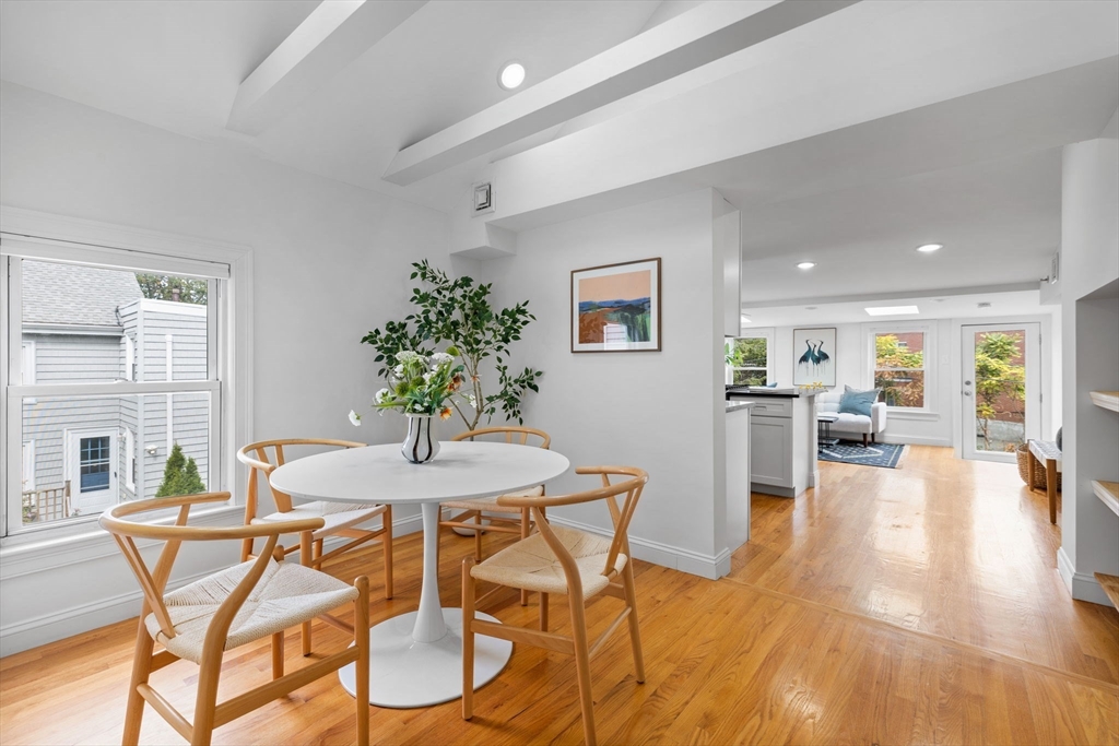 25 Clark Street, Unit 2 Somerville, MA 02143 - Photo 8 of 20 a view of a dining room with furniture and wooden floor