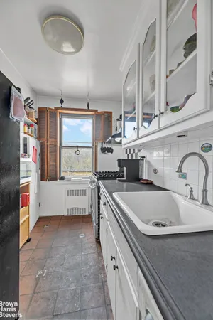 a kitchen with stainless steel appliances a sink and cabinets