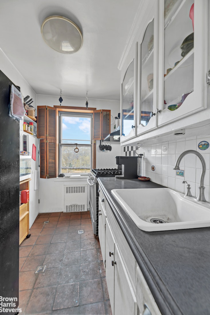 800 Grand Concourse, Unit 6CS Bronx, NY 10451 - Photo 10 of 14 a kitchen with stainless steel appliances a sink and cabinets