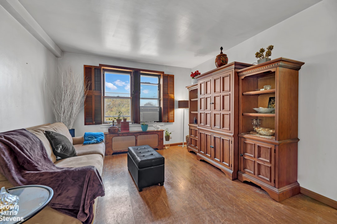 800 Grand Concourse, Unit 6CS Bronx, NY 10451 - Photo 7 of 14 a living room with furniture and a window