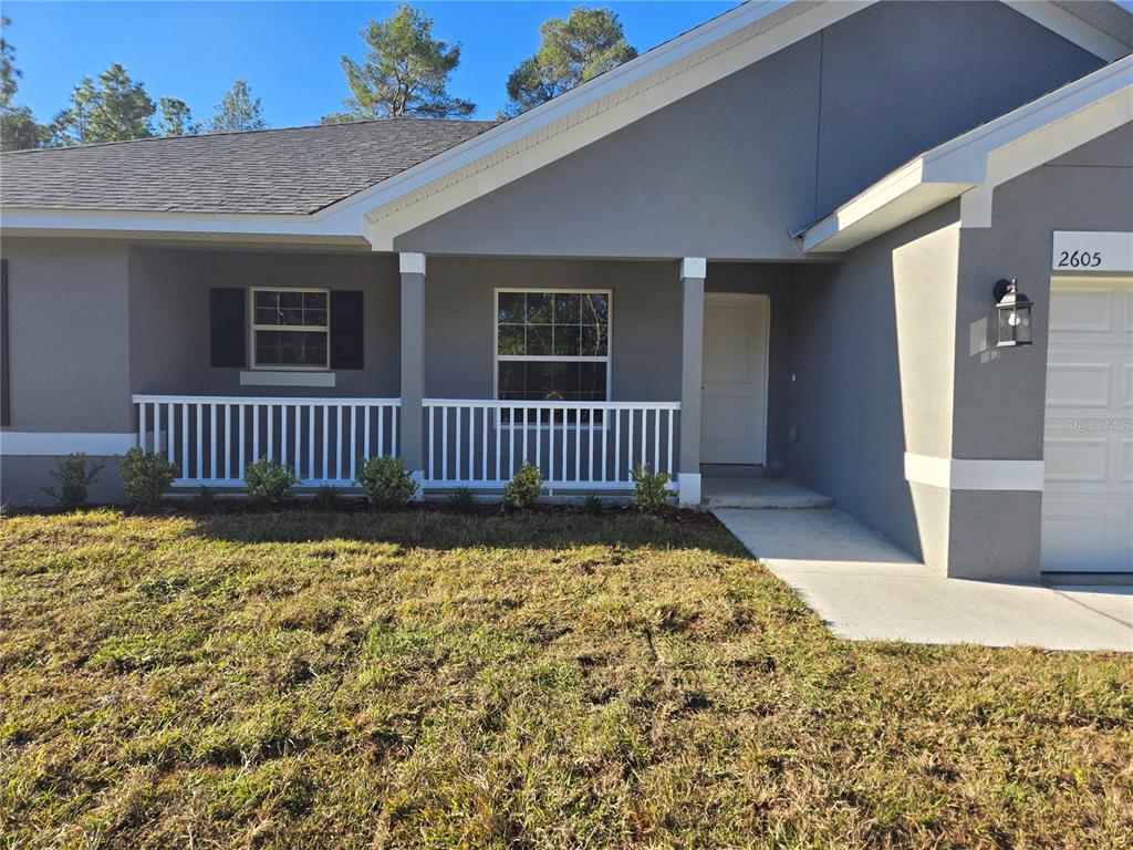 2605 Clearwood Street Inverness, FL 34452 - Photo 3 of 21 a view of a porch with a bench