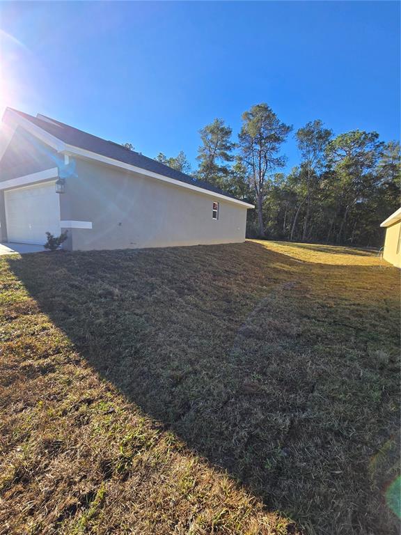 2605 Clearwood Street Inverness, FL 34452 - Photo 4 of 21 a view of a back yard of the house