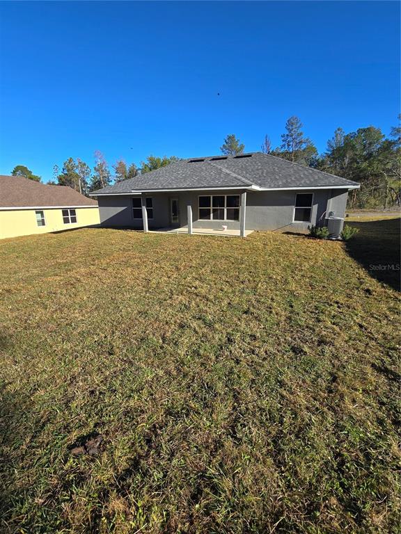 2605 Clearwood Street Inverness, FL 34452 - Photo 6 of 21 a front view of a house with a yard