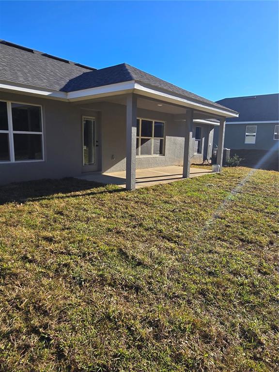 2605 Clearwood Street Inverness, FL 34452 - Photo 7 of 21 a front view of a house with garden
