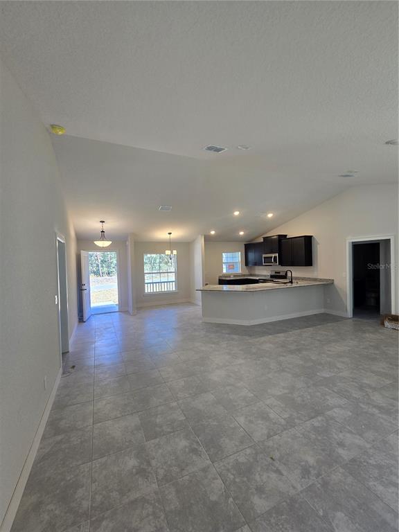 2605 Clearwood Street Inverness, FL 34452 - Photo 10 of 21 a view of a big room with closet and windows