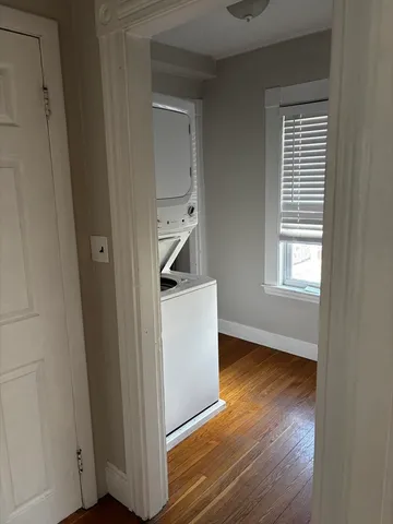 a view of an empty room and wooden floor