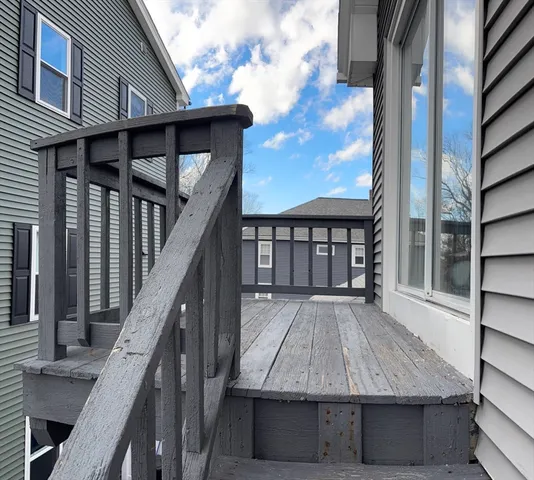 a view of house with wooden floor and stairs