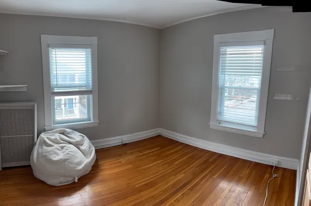 a room with window and a wooden floor