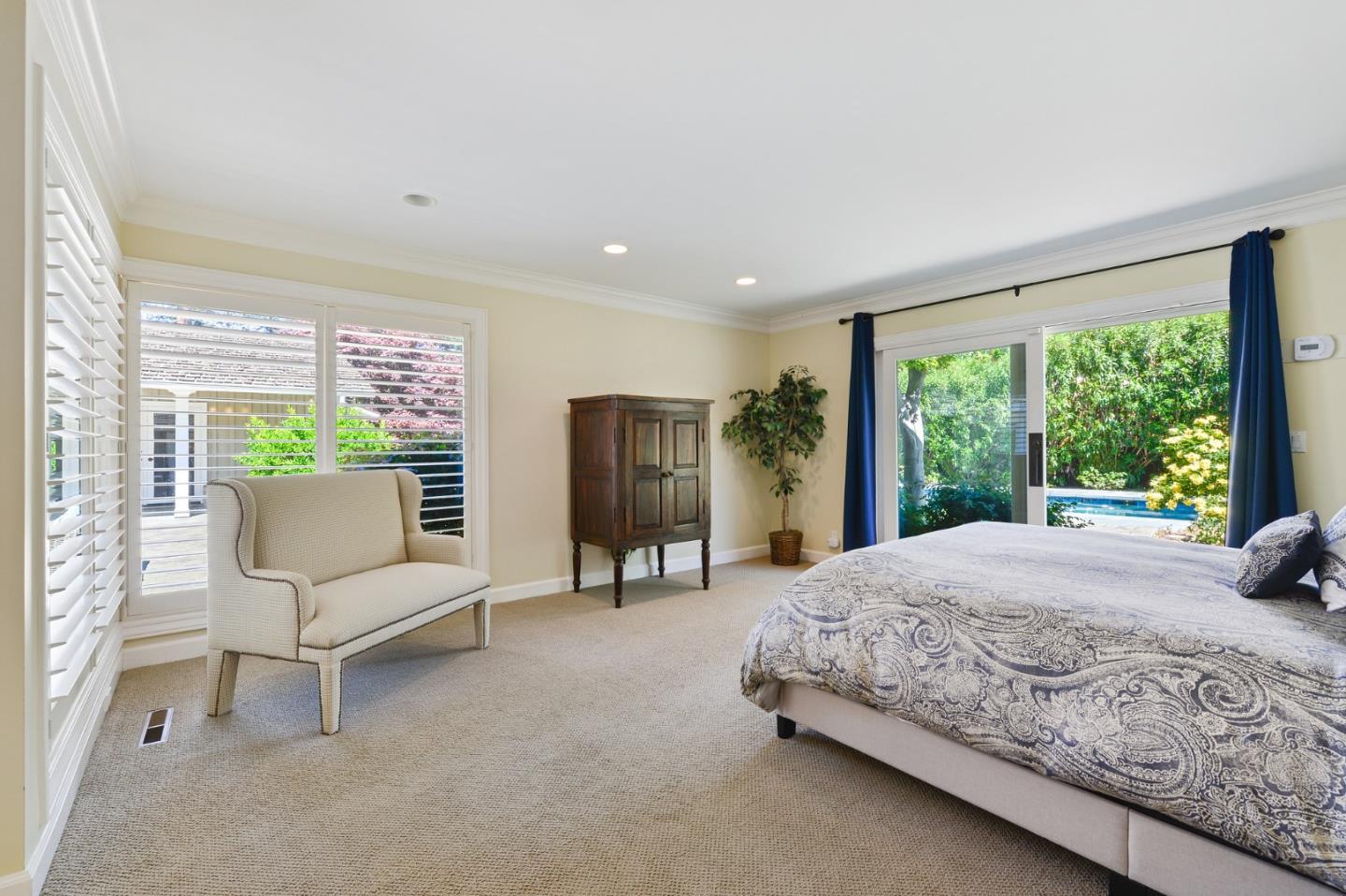 261 Atherton Avenue Atherton, CA 94027 - Photo 16 of 49 a bedroom with a bed and large window
