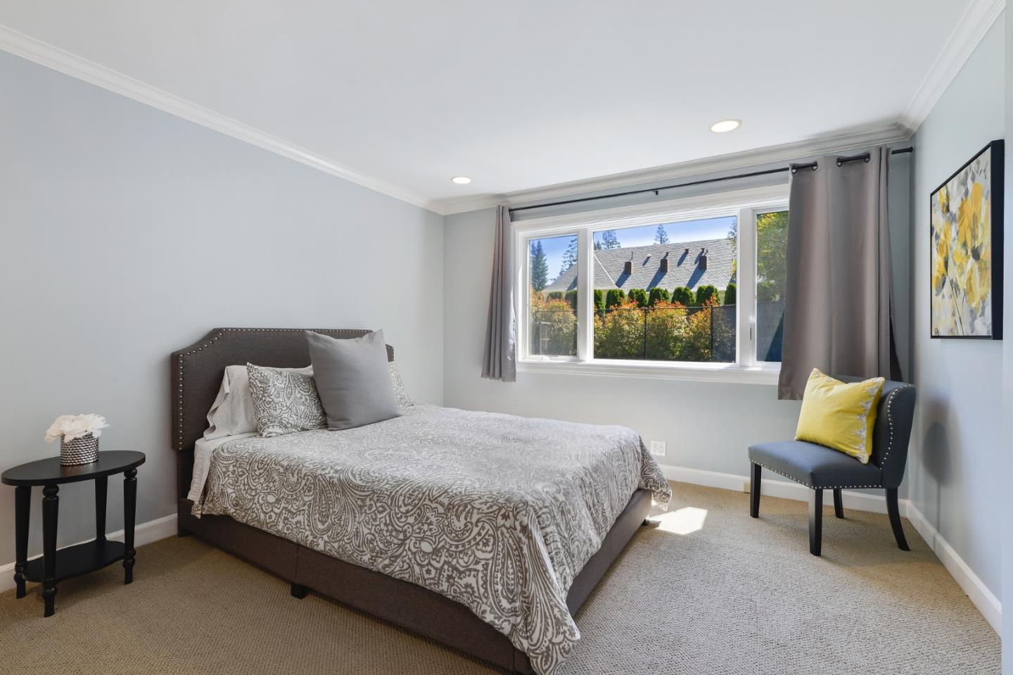 261 Atherton Avenue Atherton, CA 94027 - Photo 19 of 49 a bedroom with a bed and a painting on the wall