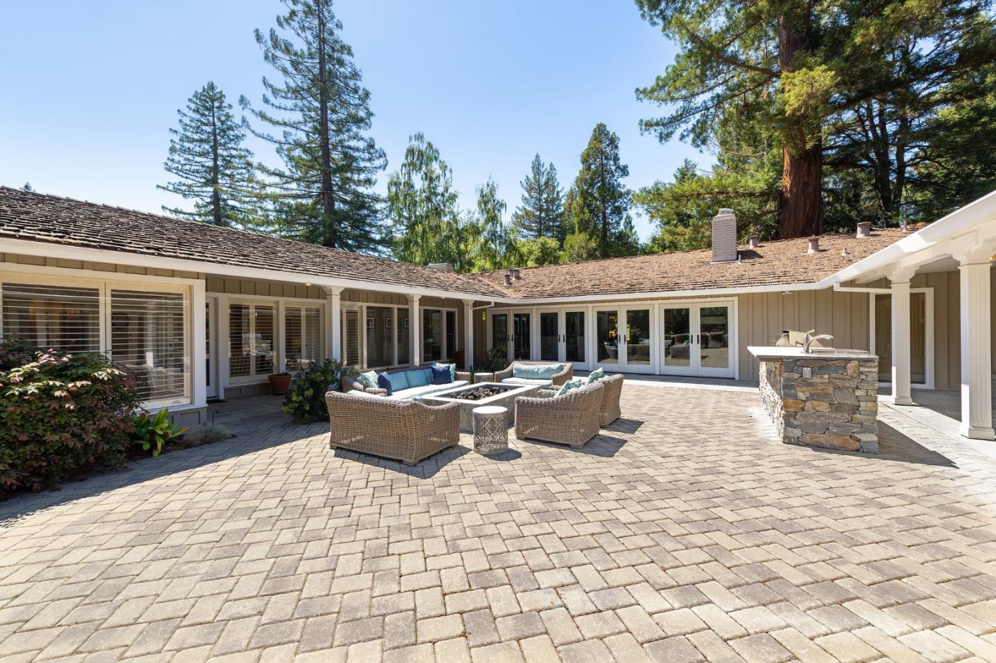 261 Atherton Avenue Atherton, CA 94027 - Photo 25 of 49 a view of the house with backyard and sitting area