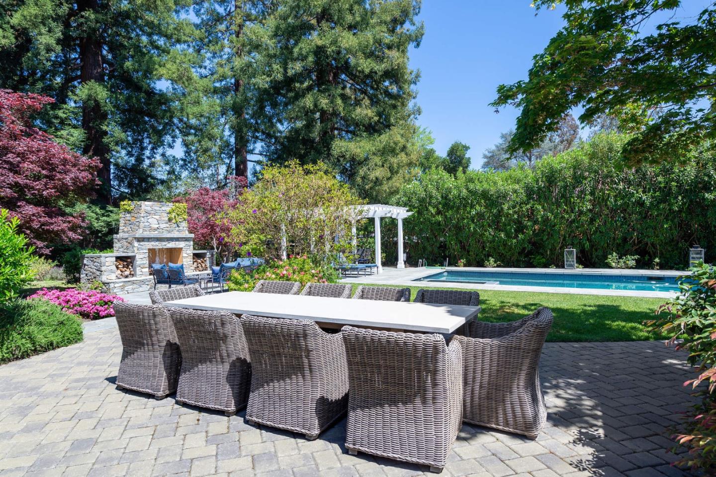 261 Atherton Avenue Atherton, CA 94027 - Photo 28 of 49 a view of a patio with table and chairs potted plants and large tree